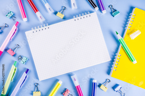 Back to school background, with bright accessories supplies for school and study - pen, pencils, markers, pencils, rulers, paperclips, sticks, notebooks, top view, free copy space for text