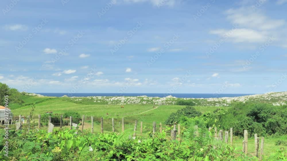 Landscape view of green hills and ocean blue water at Nothern Spain