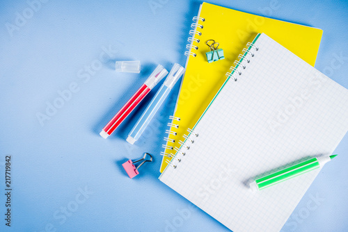 Back to school background, with bright accessories supplies for school and study - pen, pencils, markers, pencils, rulers, paperclips, sticks, notebooks, top view, free copy space for text