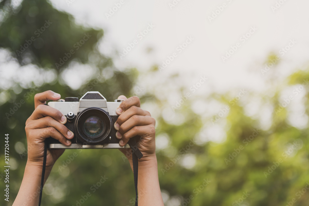Hand and camera and travel.Photography or traveler Concept. Hand and camera and travel.Photography or traveler Concept.