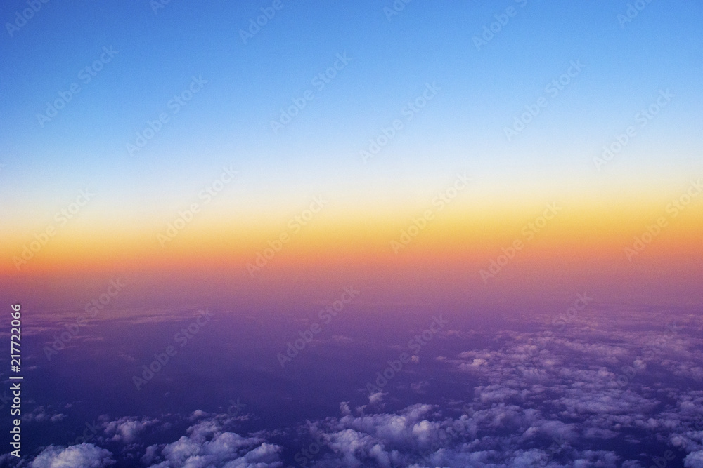 a sun setting on a plane.