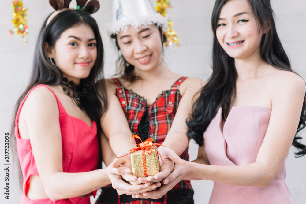 Women hold gift boxes for Christmas and Happy New Year.New Year or Christmas Concept. Women hold gift boxes for Christmas and Happy New Year.New Year or Christmas Concept.
