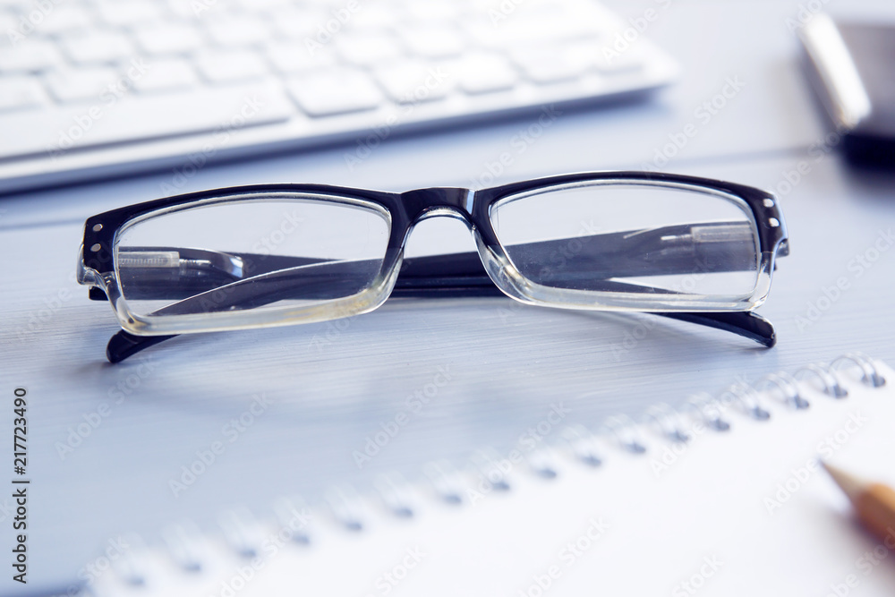 glasses on your desktop, notepad and keyboard
glasses on your desktop, notepad and keyboard