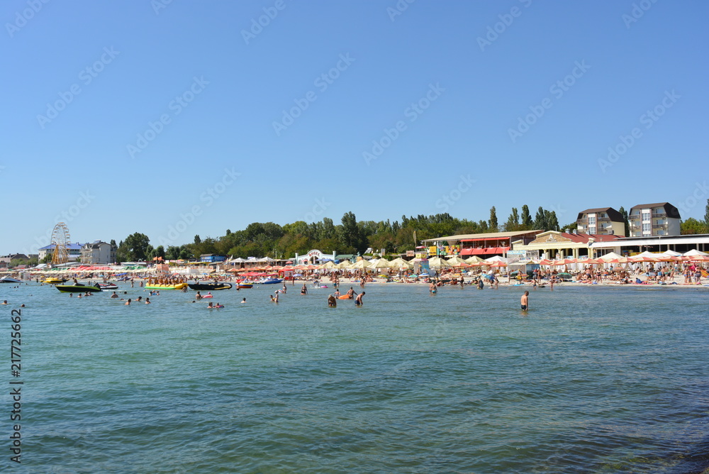 Beach with a tourist on the shore of the Black Sea, sea rest and relaxation