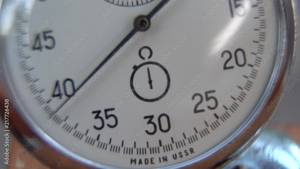 Stopwatch lies on bench, time shift concept Stopwatch lies on bench, time shift concept