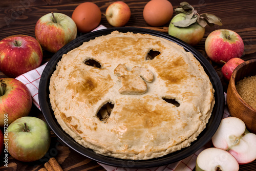 Homemade Tasty Apple Pie with Apples and Spices Wooden Background Raw Apples Cinnamone Sticks Horizontal