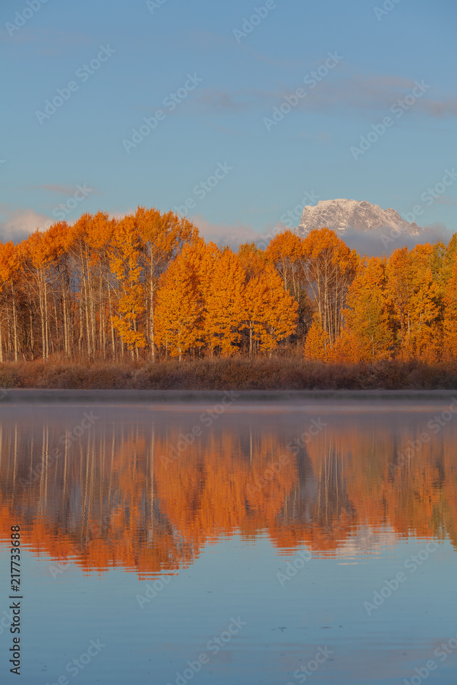 Scenic Reflection Landscape of the Tetons in Autumn