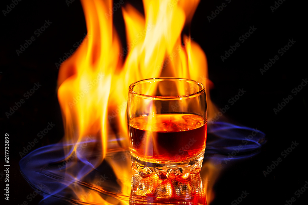 Whiskey glass with the burning fire flames