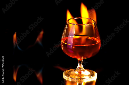 Cognac glass with the burning fire flames