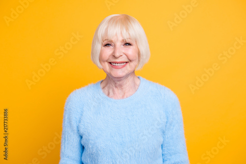 Obraz na plátne Beautiful and happy blond hair grandma looking at camera isolate