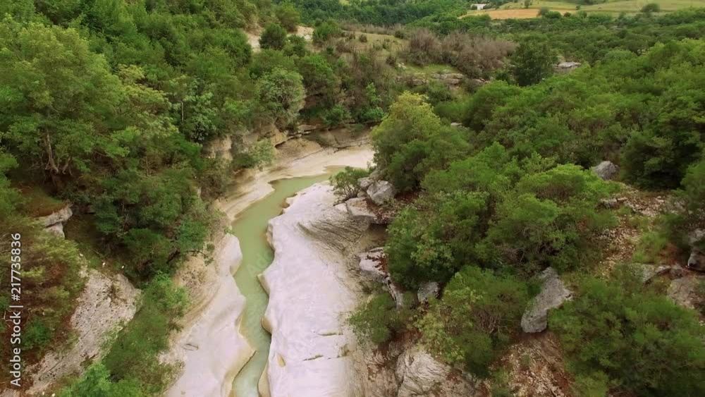Aerial drone of a river in- between a canyon. There are trees and forest on the mountains showing greenery. Aerial drone of a river in- between a canyon. There are trees and forest on the mountains showing greenery.