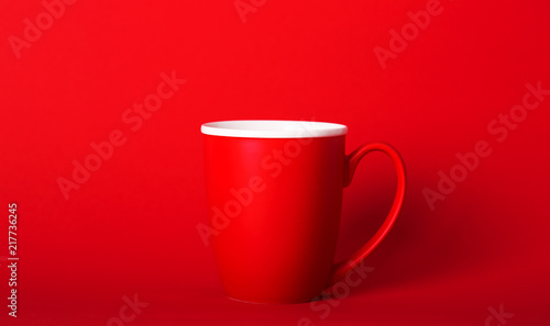 A cup of fragrant coffee on a red background for your design. Advertising coffee.