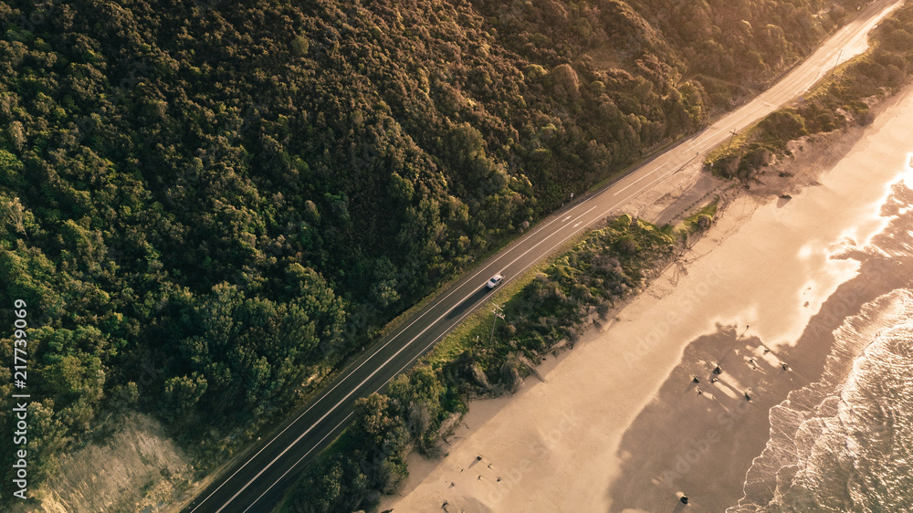 Aerial View of Waves and People and Beach Along Great Ocean Road, Victoria, Australia at Sunrise
