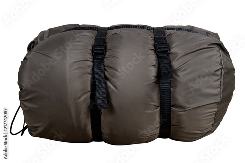 Gray sleeping bag, isolated on white background, collapsed, nylon, warm for hiking and traveling.