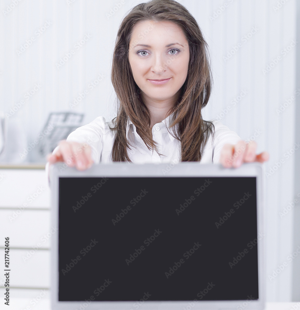 attractive businesswoman presenting a laptop with copyspace on the monitor attractive businesswoman presenting a laptop with copyspace on the monitor