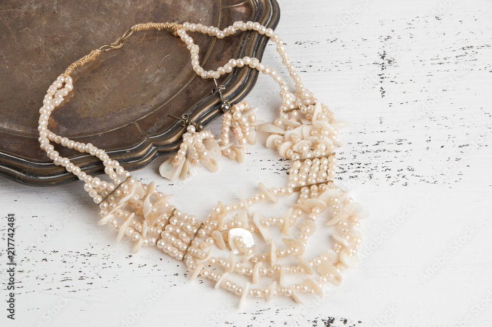 Fototapeta premium Vintage necklace and earrings in metal plate