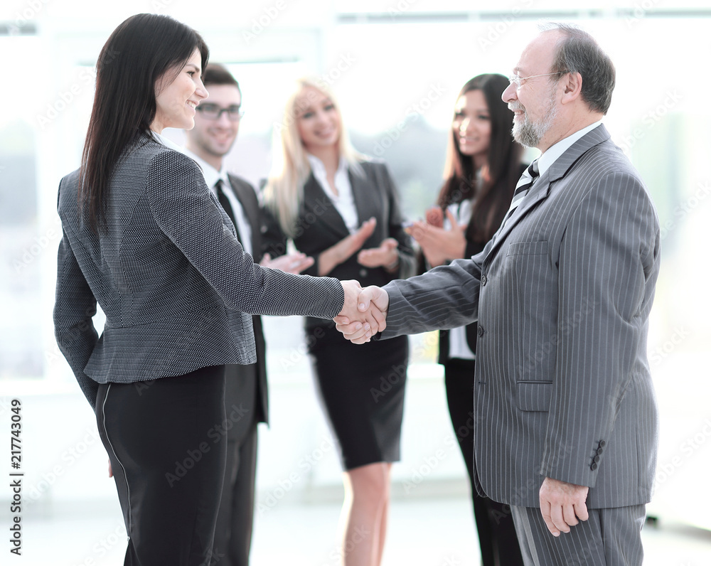 handshake of a businessman and business woman handshake of a businessman and business woman