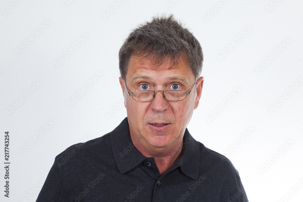portrait of astonished senior man in studio