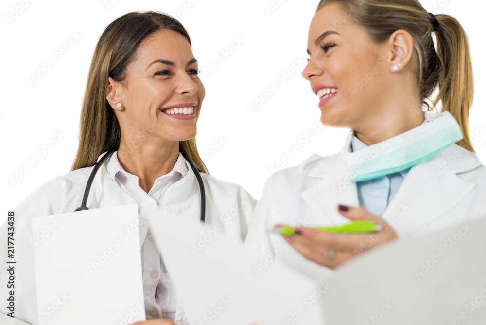 Pretty young female doctors on the white background Pretty young female doctors on the white background