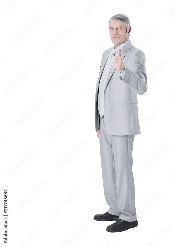 in full growth.Mature businessman showing thumb up in full growth.Mature businessman showing thumb up