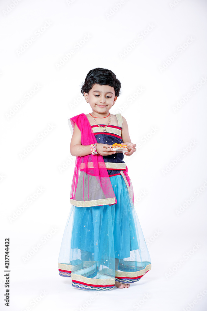 Little Indian girl child with lord ganesha and praying , Indian ganesh festival Little Indian girl child with lord ganesha and praying , Indian ganesh festival