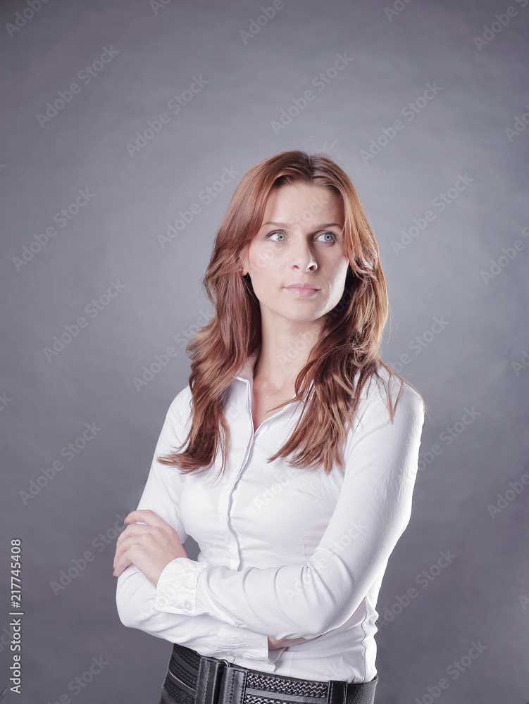 portrait of a focused business woman isolated on a dark background portrait of a focused business woman isolated on a dark background