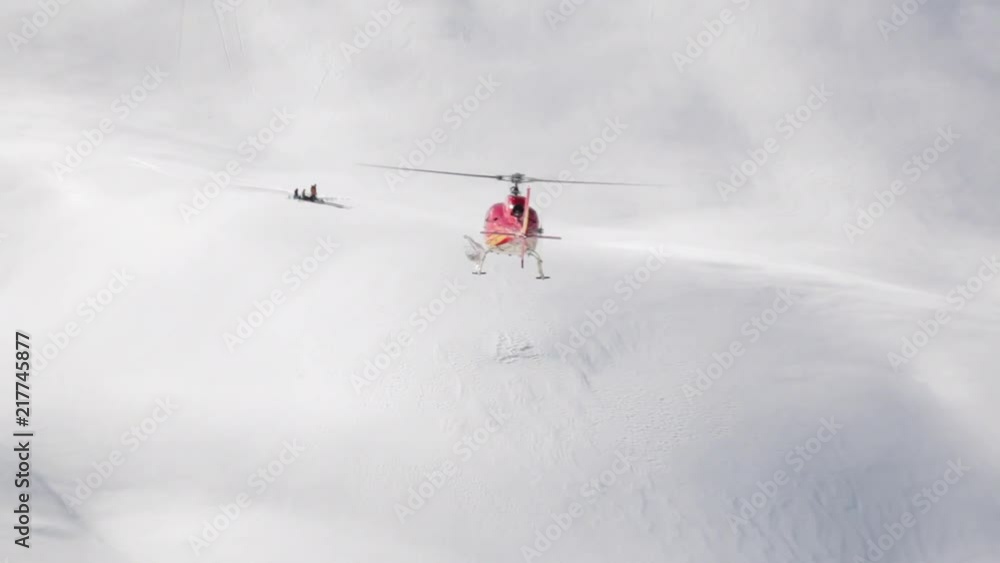 Helicopter as part of a heli ski operation in the Himalayas. Red helicopter in Kashmir, India. Big mountains, lot's of snow and trees. Helicopter as part of a heli ski operation in the Himalayas. Red helicopter in Kashmir, India. Big mountains, lot's of snow and trees.