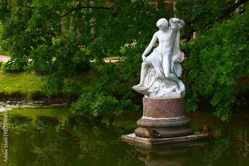 ancient sculptures in the summer park