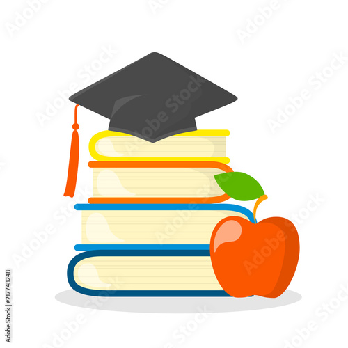 Stack of books with graduation cap on the top