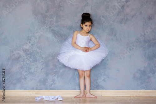Photography Little girl ballerina in a white tutu