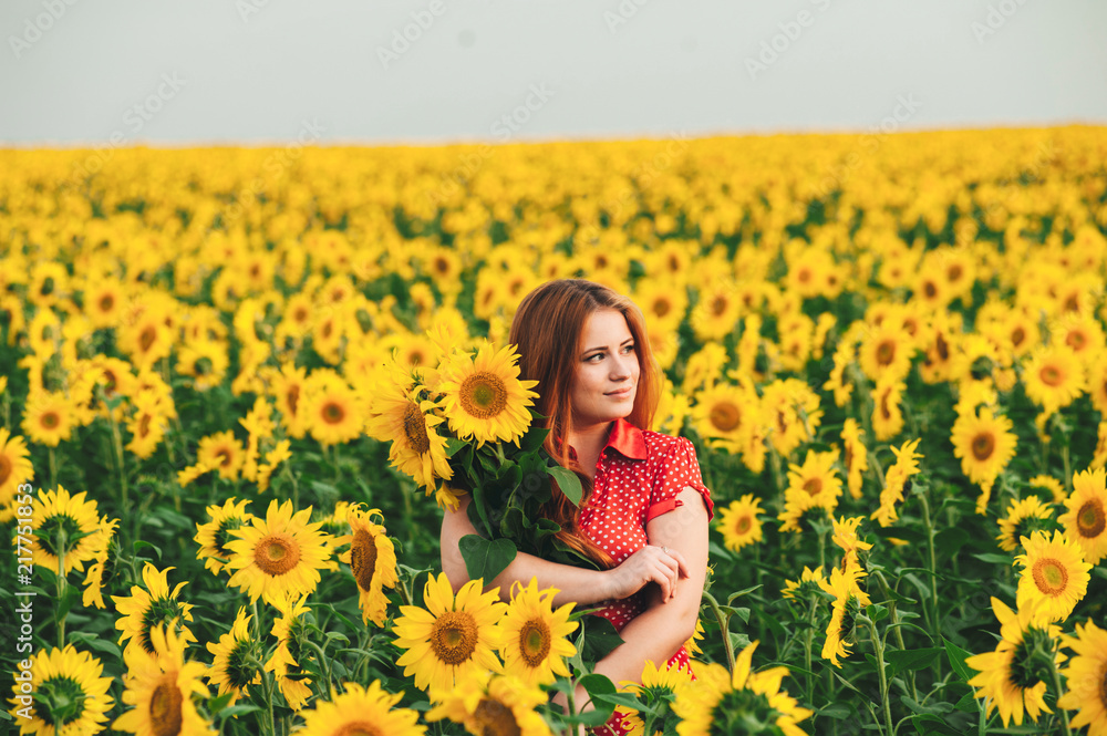 Beautiful girl in a huge yellow field of sunflowers. Beautiful girl in a huge yellow field of sunflowers.