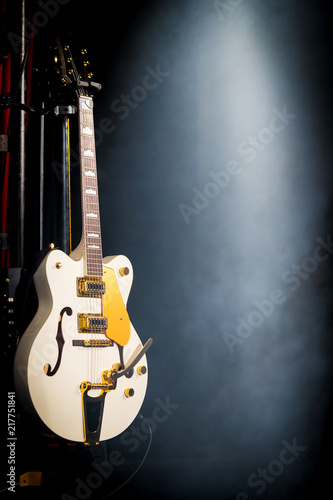 Guitar on a stage with fog in the background