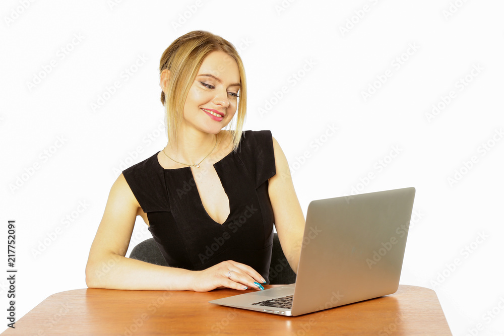 Girl businesswoman working behind laptop, computer isolated on white background