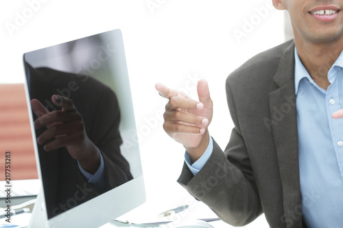 closeup.handsome businessman pointing on the computer screen photo