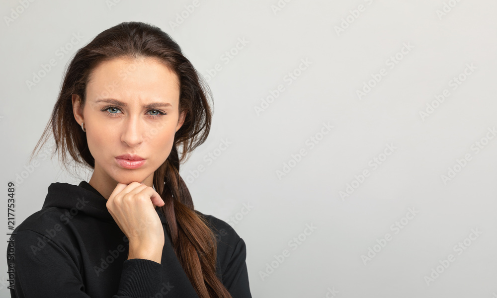 girl frowns and looks strictly into the frame girl frowns and looks strictly into the frame