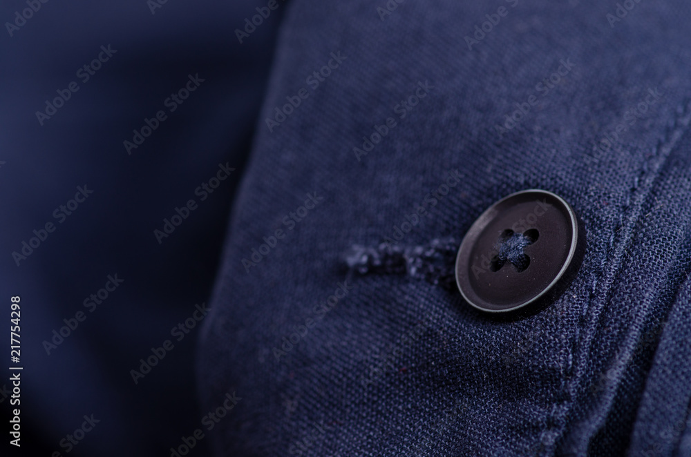 Blue fabric material texture button macro blur background Blue fabric material texture button macro blur background