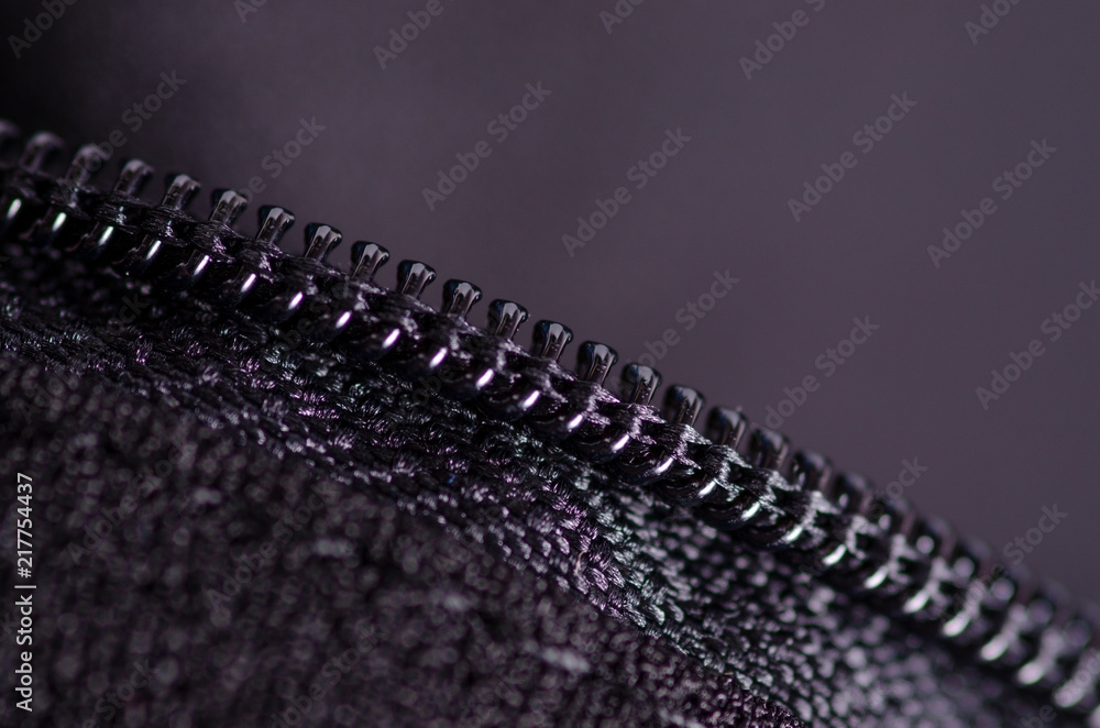 Black fabric material texture macro zipper blur background