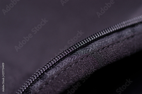 Black fabric material texture macro zipper blur background