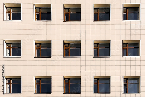 Square Windows of the building on a yellow background, lots of Windows
