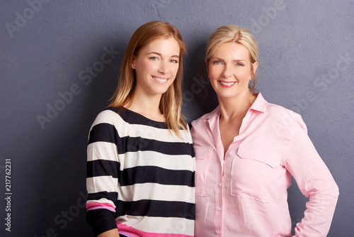 Beautiful mother and daughter studio shot