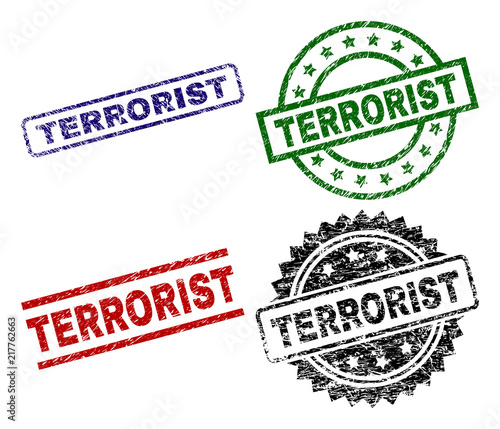 TERRORIST seal prints with damaged surface. Black, green,red,blue vector rubber prints of TERRORIST label with retro surface. Rubber seals with circle, rectangle, medal shapes. photo