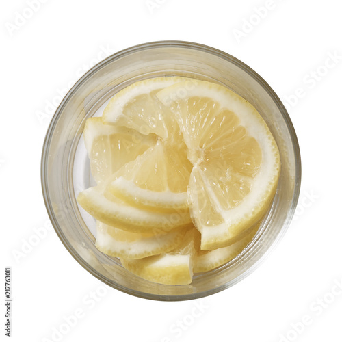 Lemon in bowl. Preparing ingredients for cooking. Isolated on white background. Top view. photo