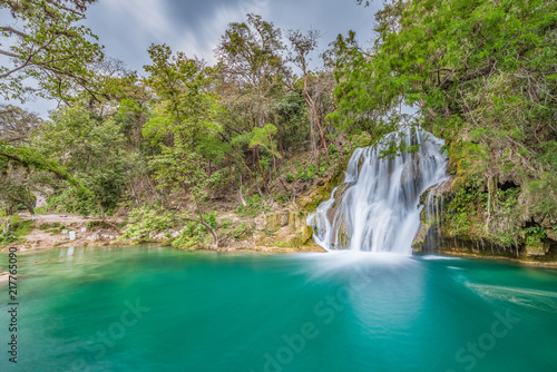 Amazing crystalline blue water of Tamasopo waterfalls at Huasteca Potosina in San Luis Potosi, Mexico