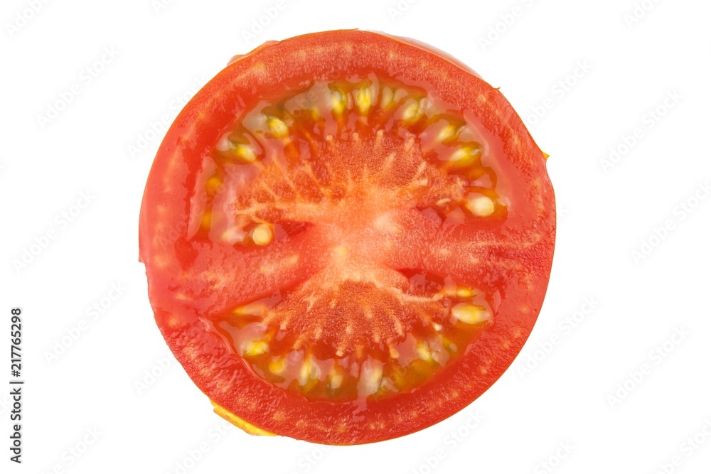 Tomato slice isolated on white background, top view. Fresh home-made vegetables. Growing tomatoes. Preparation of vegetable salad. Vegetarian food.