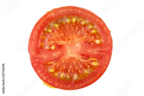 Tomato slice isolated on white background, top view. Fresh home-made vegetables. Growing tomatoes. Preparation of vegetable salad. Vegetarian food.