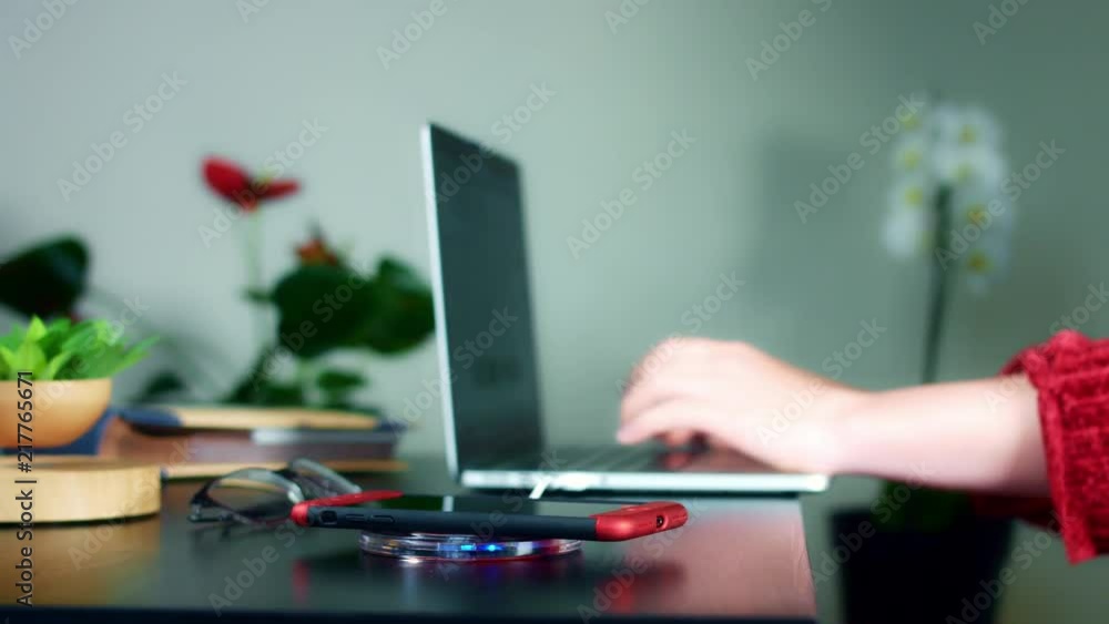 4k Business Woman Putting Smartphone on Wireless Charger 4k Business Woman Putting Smartphone on Wireless Charger