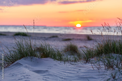 Fototapeta Naklejka Na Ścianę i Meble -  Sandy beach with sunset on background
