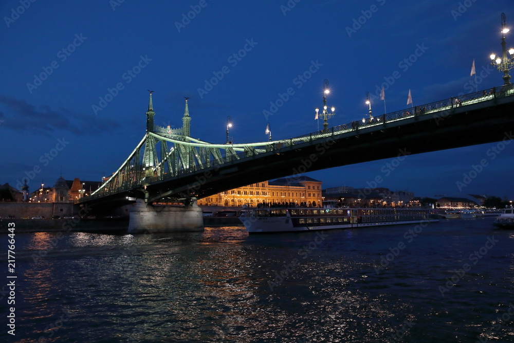 Fototapeta premium Panoramic views of night bridges through Danube with illumination.