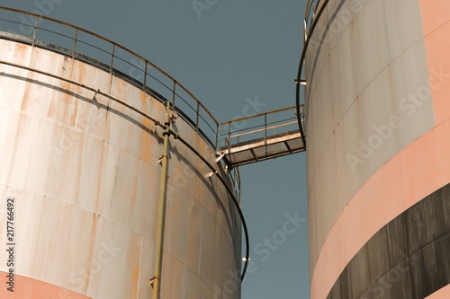 Oil storage tank with metal bridge and stairs (Pesaro, Italy, Europe)