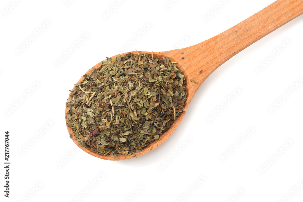 dried mint in wooden spoon isolated on white background dried mint in wooden spoon isolated on white background
